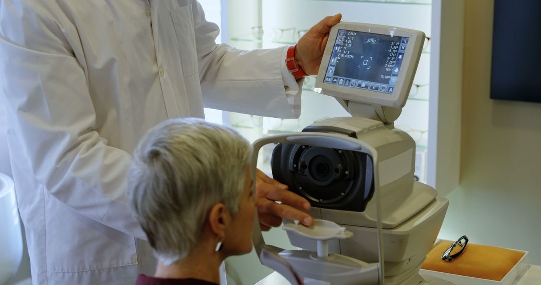 An experienced healthcare worker uses advanced eye exam equipment on an elderly patient. - Free Images, Stock Photos and Pictures on Pikwizard.com