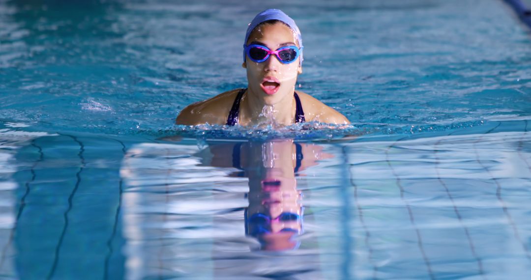 Female Competitive Swimmer Training in Indoor Pool - Free Images, Stock Photos and Pictures on Pikwizard.com