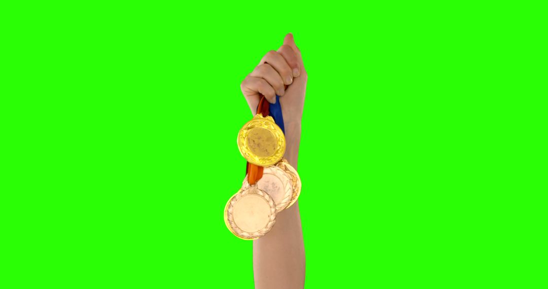 Hand Holding Gold, Silver, and Bronze Medals on Colorful Ribbons - Free Images, Stock Photos and Pictures on Pikwizard.com