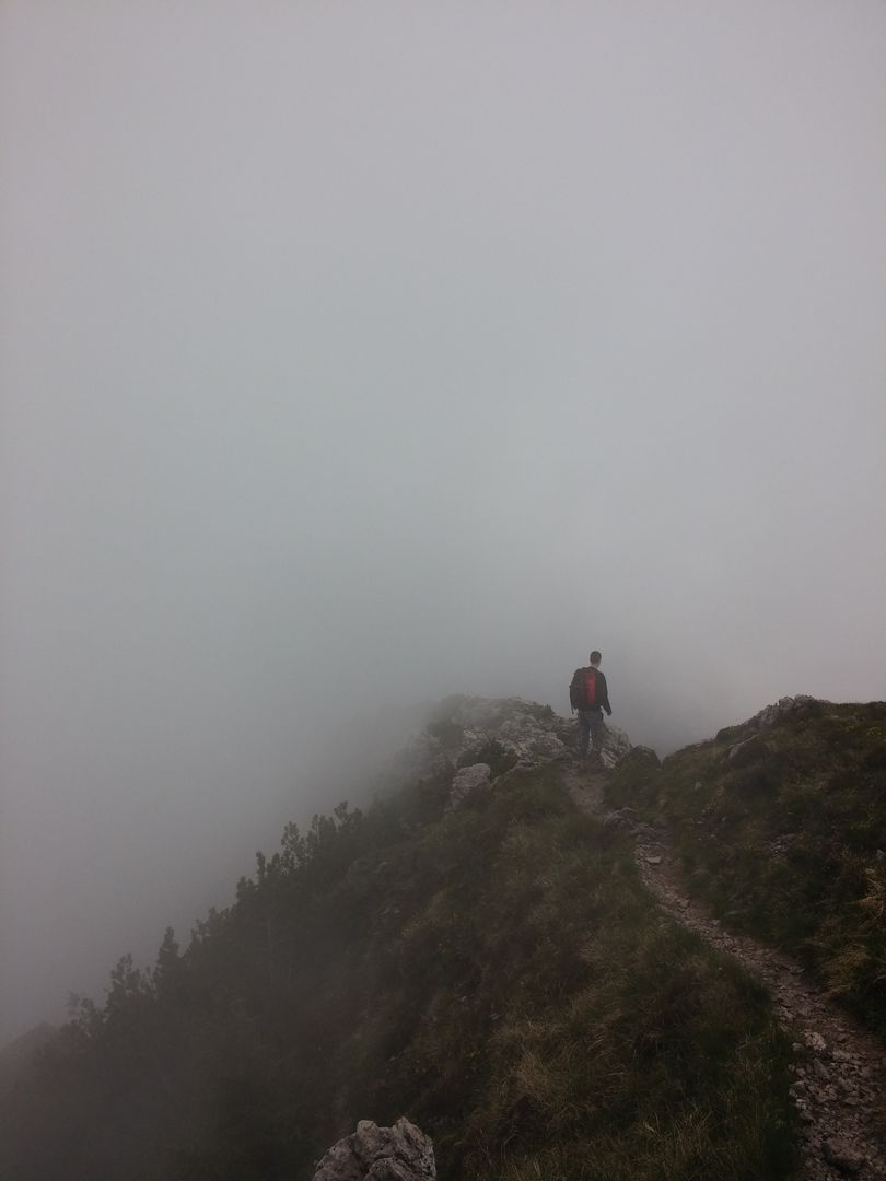 Person Hiking on Foggy Mountain Ridge - Free Images, Stock Photos and Pictures on Pikwizard.com