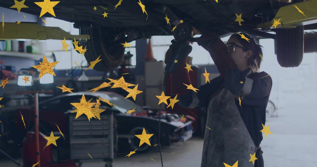 Skilled Mechanic Using Power Tool in Auto Workshop