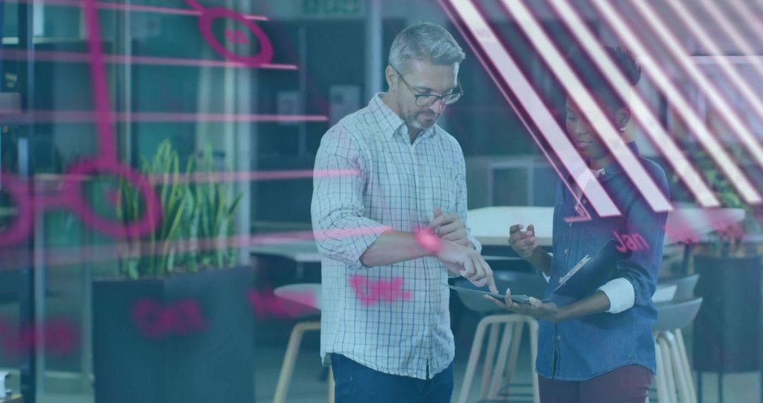 Collaborative team reviewing tablet and brainstorming on glass wall notes using stylus