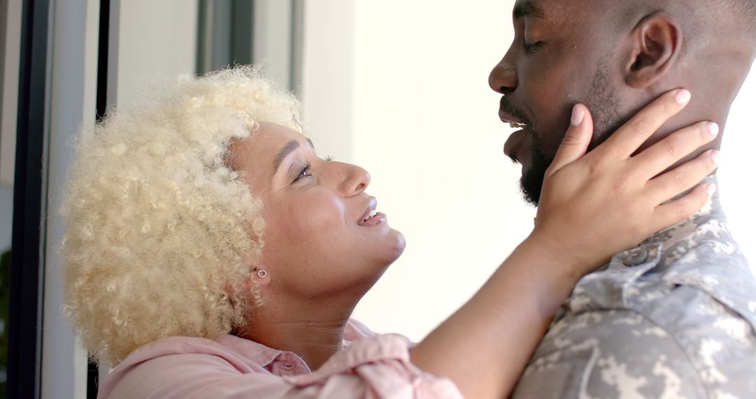 Joyful Reunion of Couple with Military Uniform