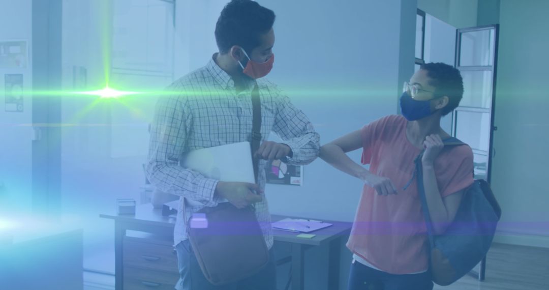 Coworkers Greeting with Elbow Bump in Modern Office