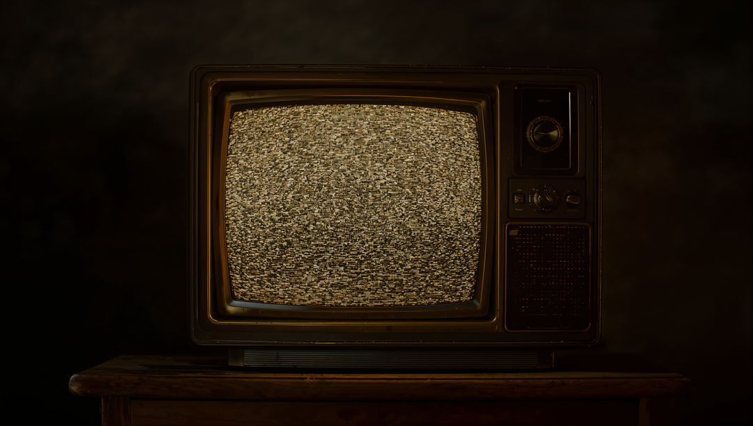 Vintage CRT Television with Static Display in Dimly Lit Room