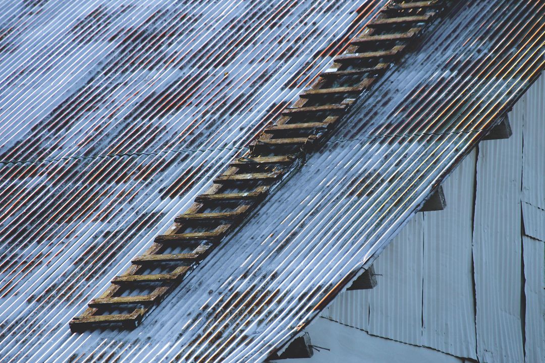 Rustic Snow-covered Roof with Wooden Ladder