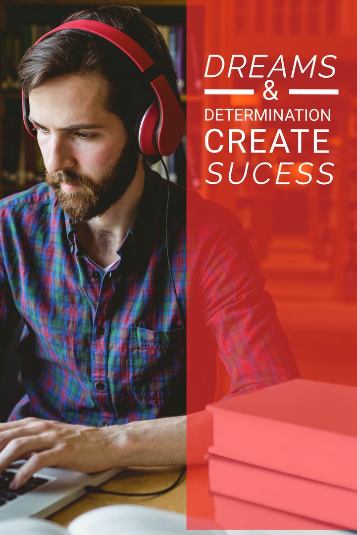 Focused Man with Headphones Typing on Laptop in Library