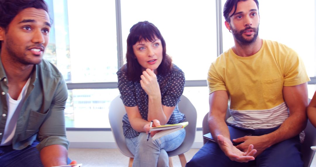 Diverse Professionals in Collaborative Meeting Discussion