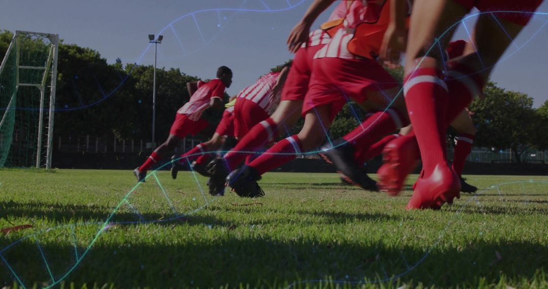 Soccer Players Sprinting on Sunny Field with Fitness Elements