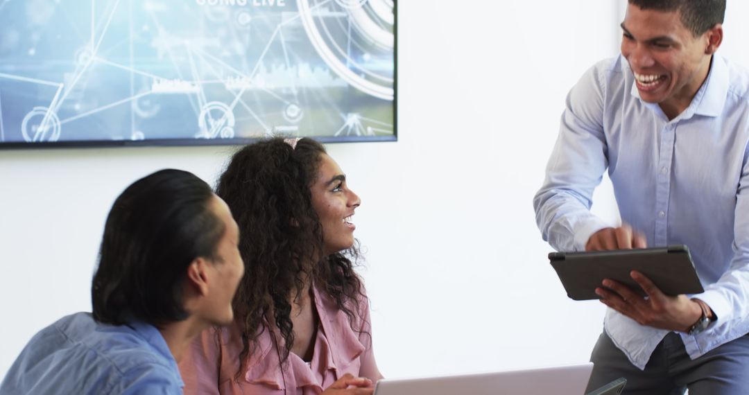 Diverse Team Collaborating Joyfully on Project Presentation