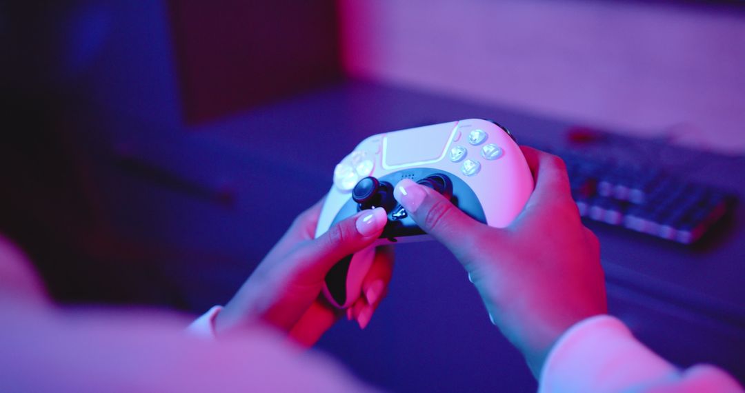 Close-Up of Woman's Hands Gripping Video Game Controller