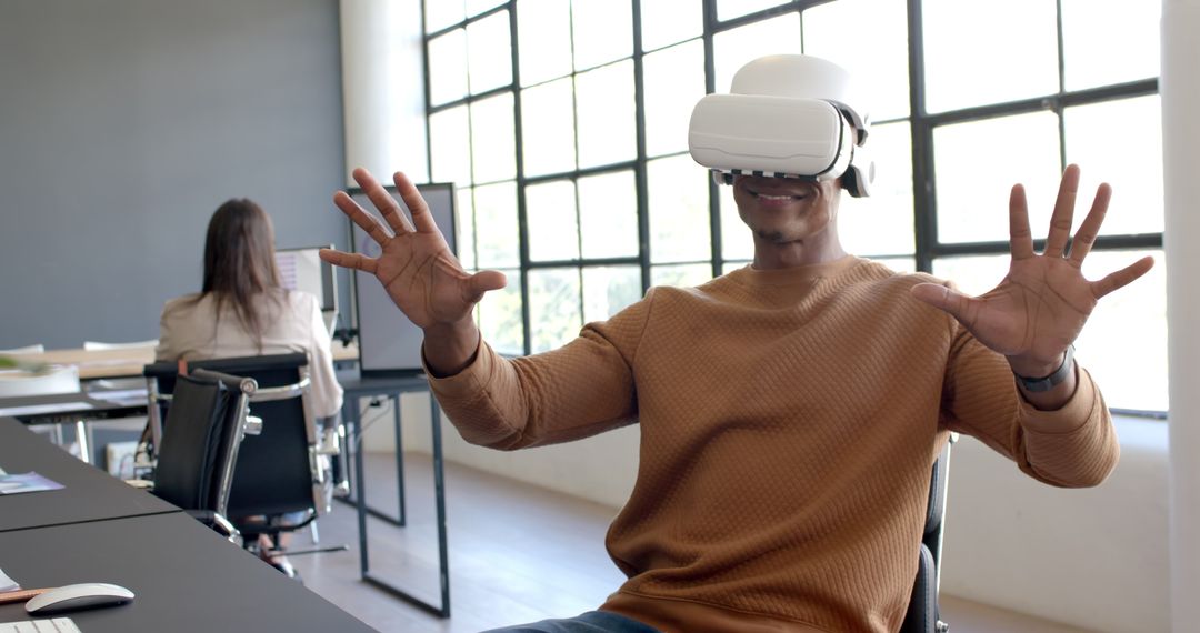 Man Using VR Headset Giving Thumbs Up in Modern Office Setting