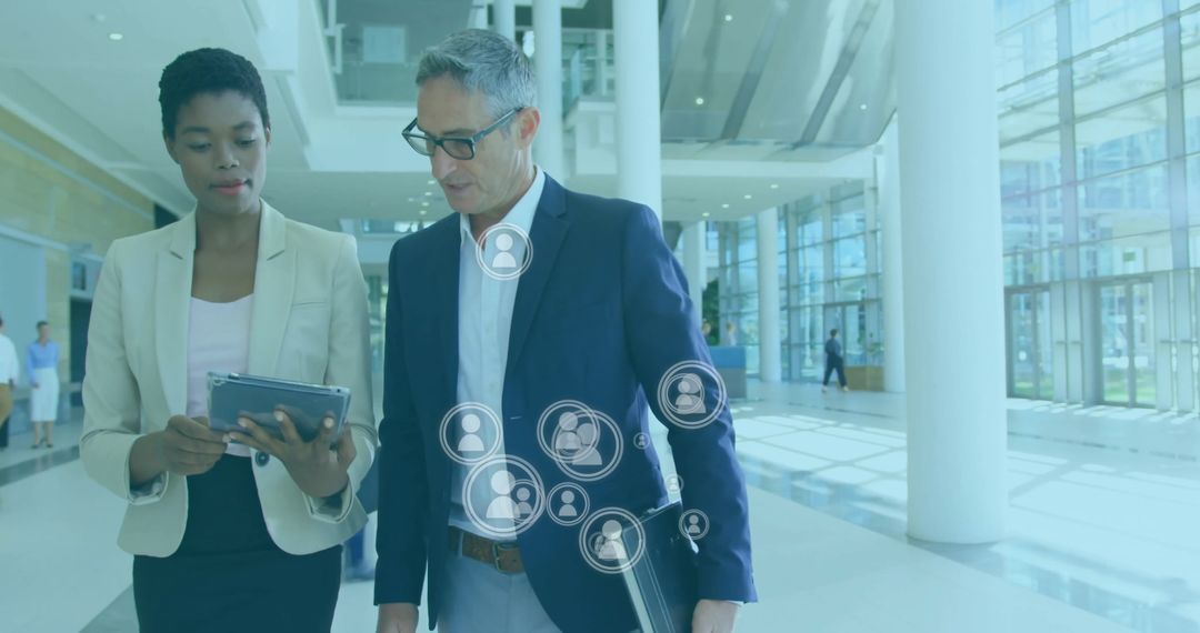 Business Professionals Networking with Digital Interface in Modern Office