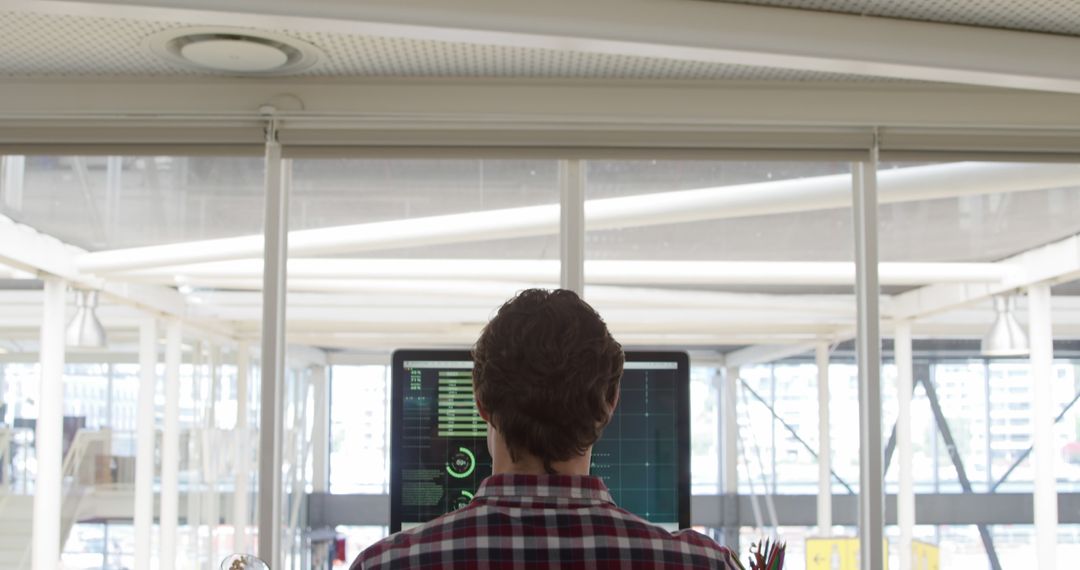 Developer Using Dual Monitors in Open Workspace - Free Images, Stock Photos and Pictures on Pikwizard.com