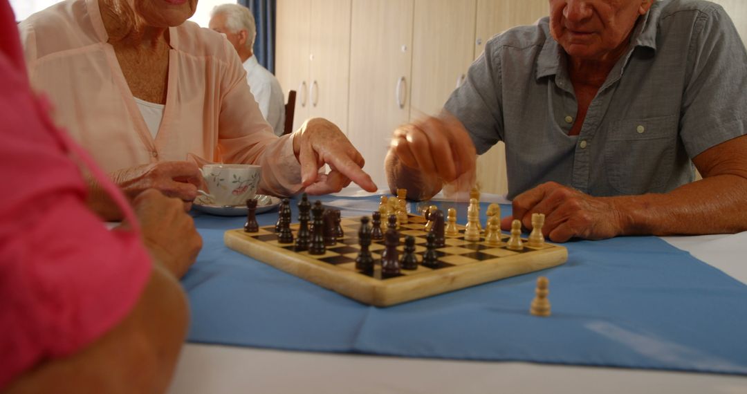 Group of Seniors Enjoying Chess Game in Community Center - Free Images, Stock Photos and Pictures on Pikwizard.com