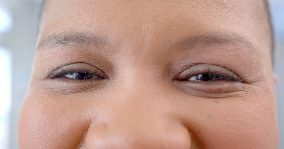 Close-Up of a Woman's Smiling Eyes and Nose - Free Images, Stock Photos and Pictures on Pikwizard.com