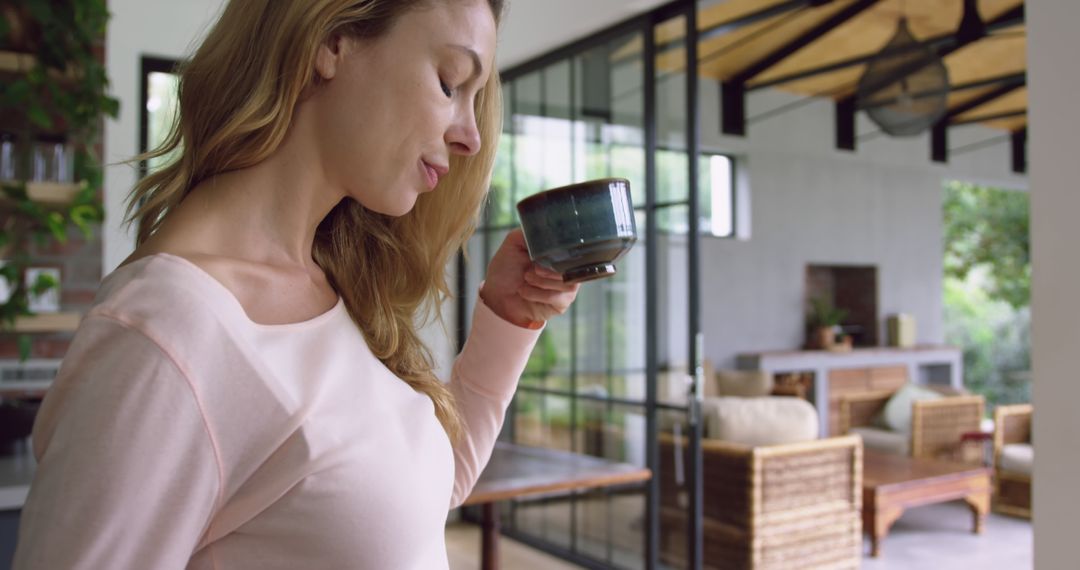 Serene Woman Enjoying Morning Coffee in Modern Home - Free Images, Stock Photos and Pictures on Pikwizard.com