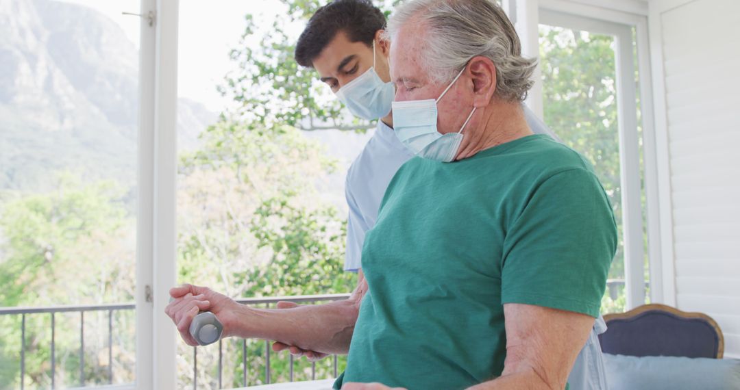 Physical Therapist Helping Senior Man with Arm Exercises - Free Images, Stock Photos and Pictures on Pikwizard.com