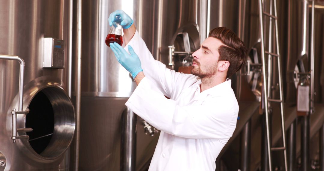 Scientist Analyzing Liquid Sample in Brewery Laboratory - Free Images, Stock Photos and Pictures on Pikwizard.com