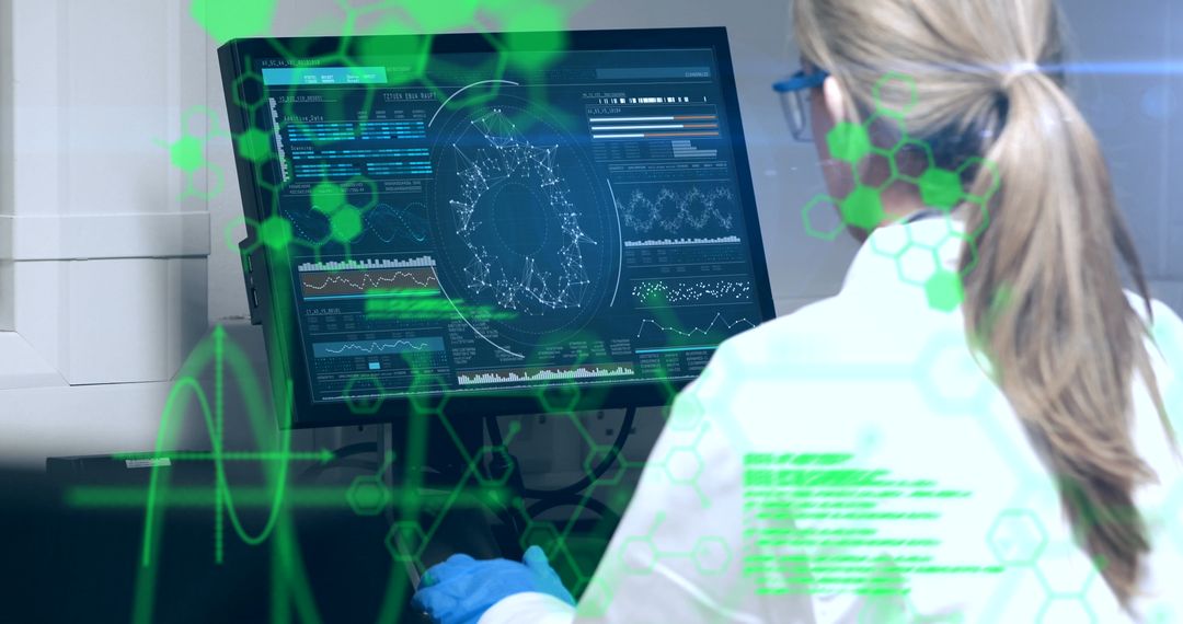 Scientist Analyzing Data on Computer with Digital Interface Overlay - Free Images, Stock Photos and Pictures on Pikwizard.com