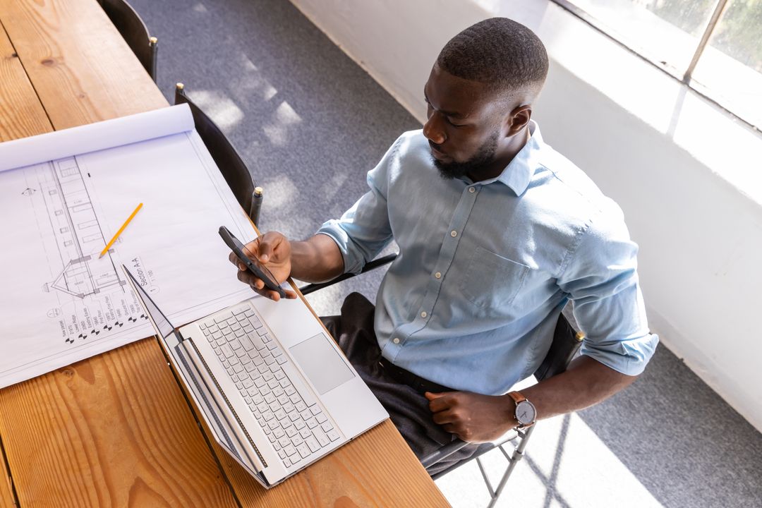 Architect Consulting Smartphone and Laptop Blueprint Drawing Office Desk