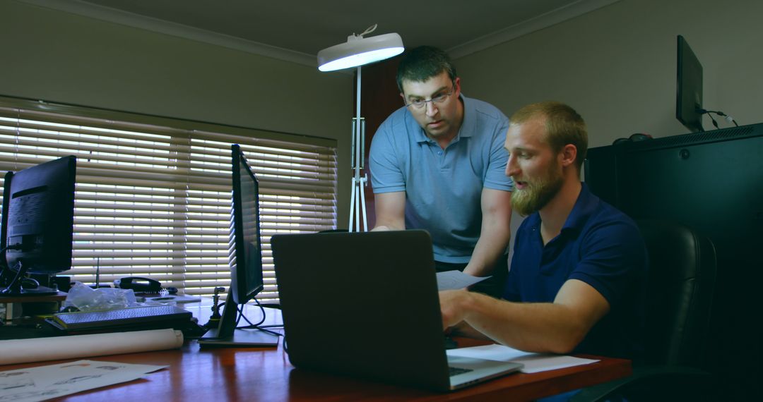 Two Men Collaborating on a Project in Office - Free Images, Stock Photos and Pictures on Pikwizard.com