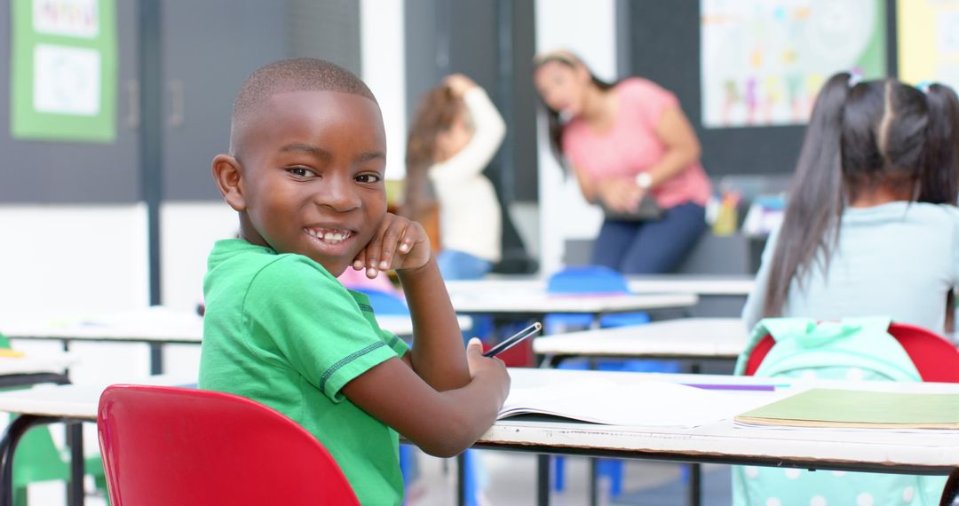 Smiling Young Student with Notebook in Daylit Classroom