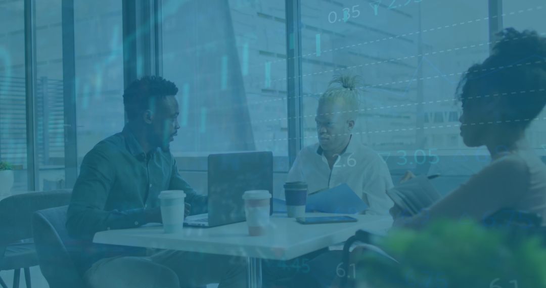 Diverse Team Discussing Financial Data in Modern Office Space