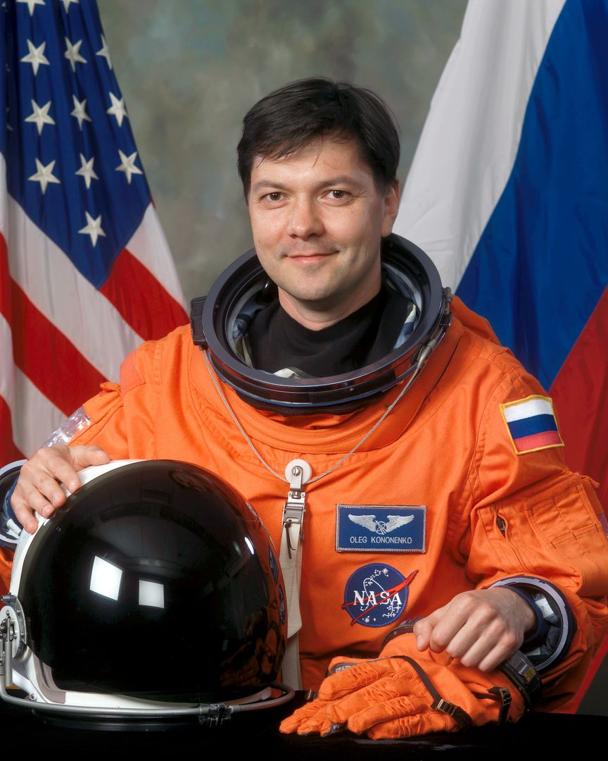 Russia Federal Space Agency Cosmonaut Oleg Kononenko in Orange Space Suit - Free Images, Stock Photos and Pictures on Pikwizard.com