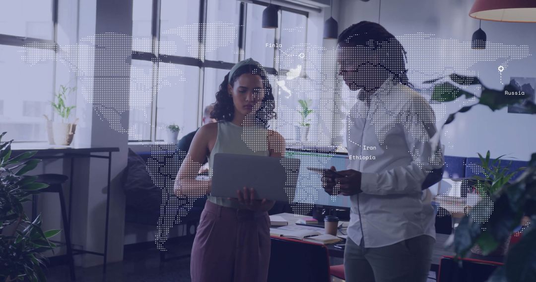 Team Analyzing Data in Modern Office with Digital Map Overlay