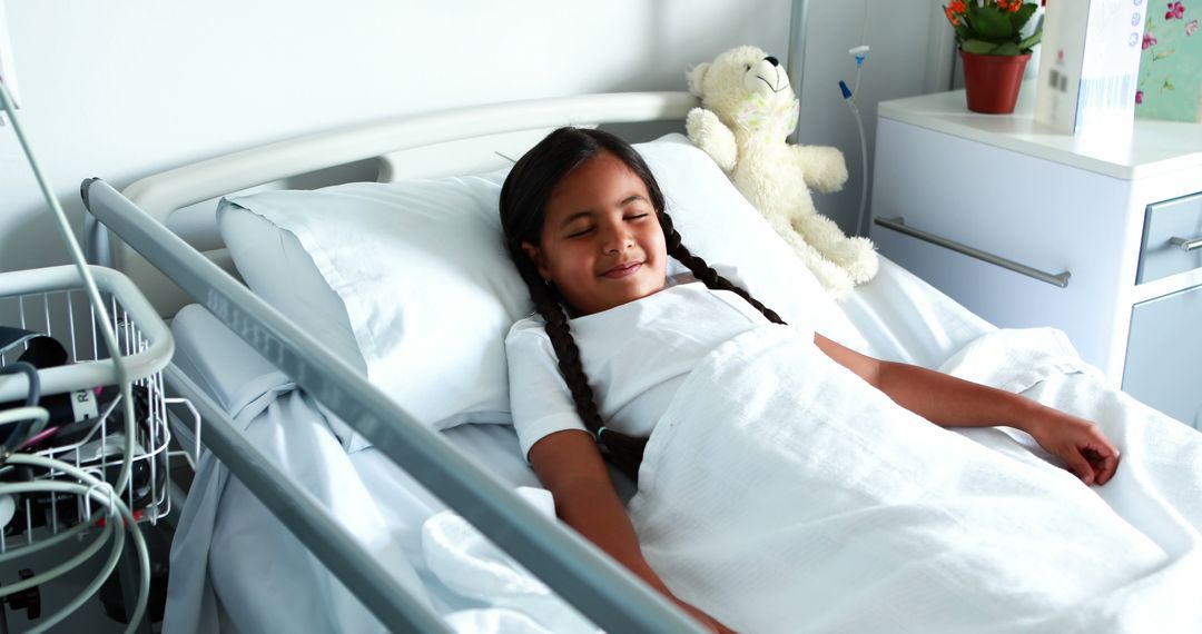 Child resting in hospital bed with comforting environment - Free Images, Stock Photos and Pictures on Pikwizard.com