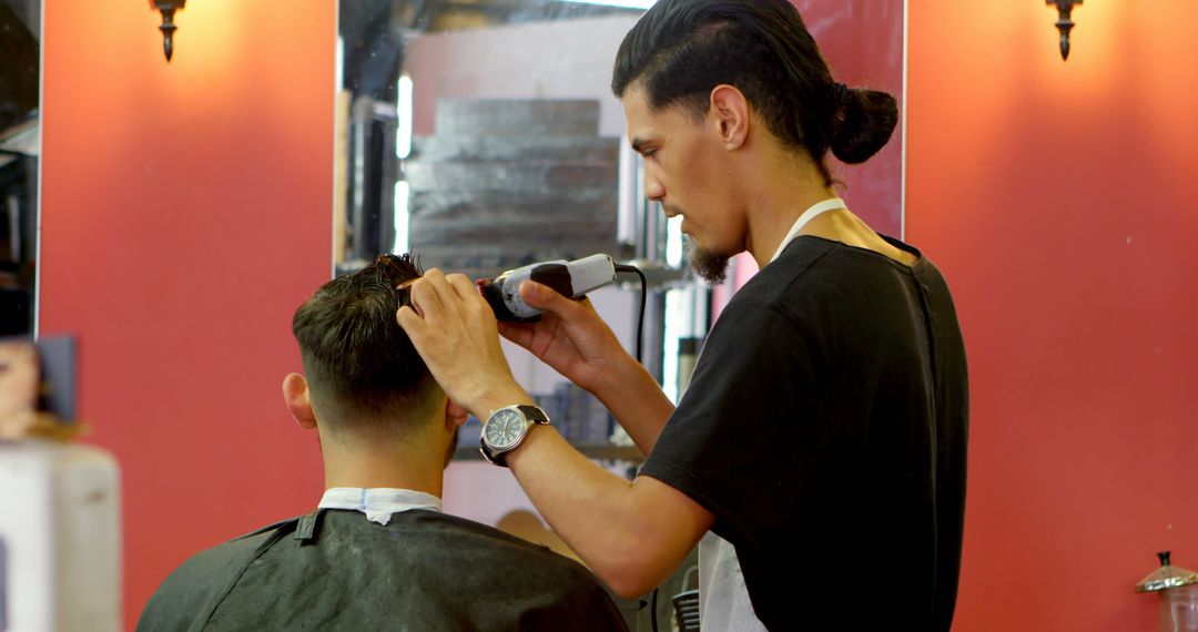 Barber Giving Haircut to Man in Barbershop - Free Images, Stock Photos and Pictures on Pikwizard.com