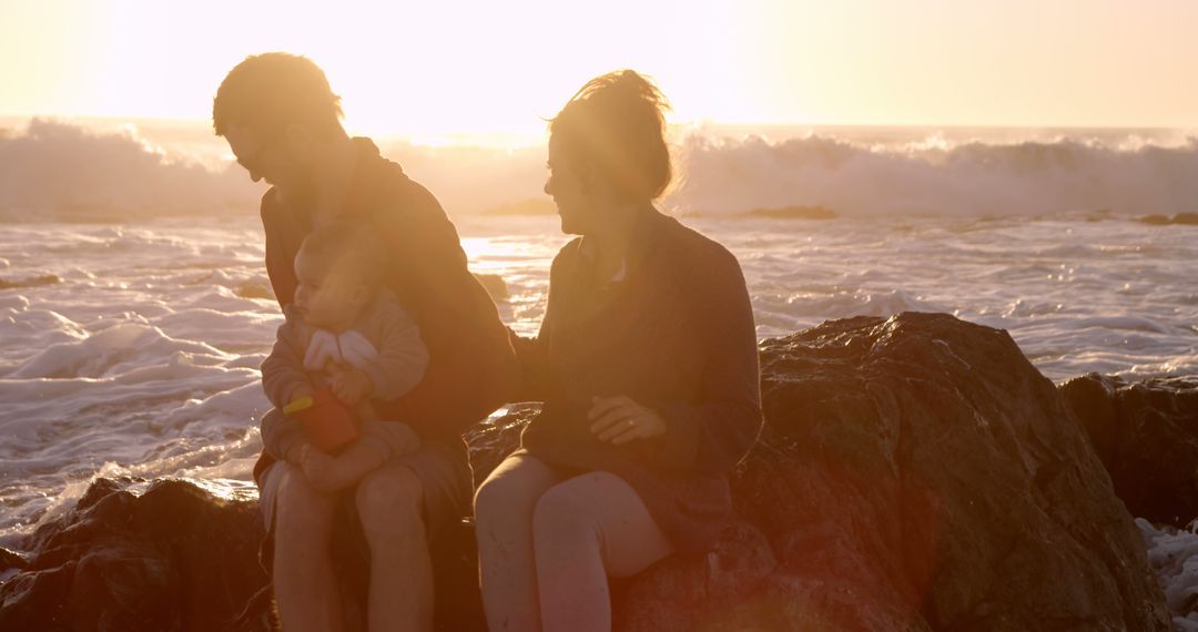 Family of Three Enjoying Sunset at the Beach - Free Images, Stock Photos and Pictures on Pikwizard.com