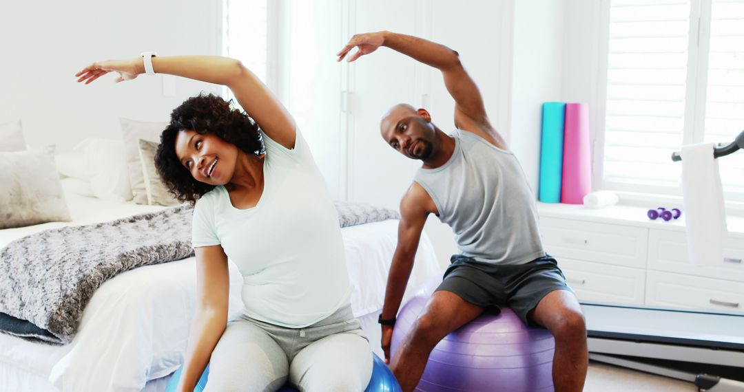 Couple Enjoying Home Fitness Routine with Exercise Balls