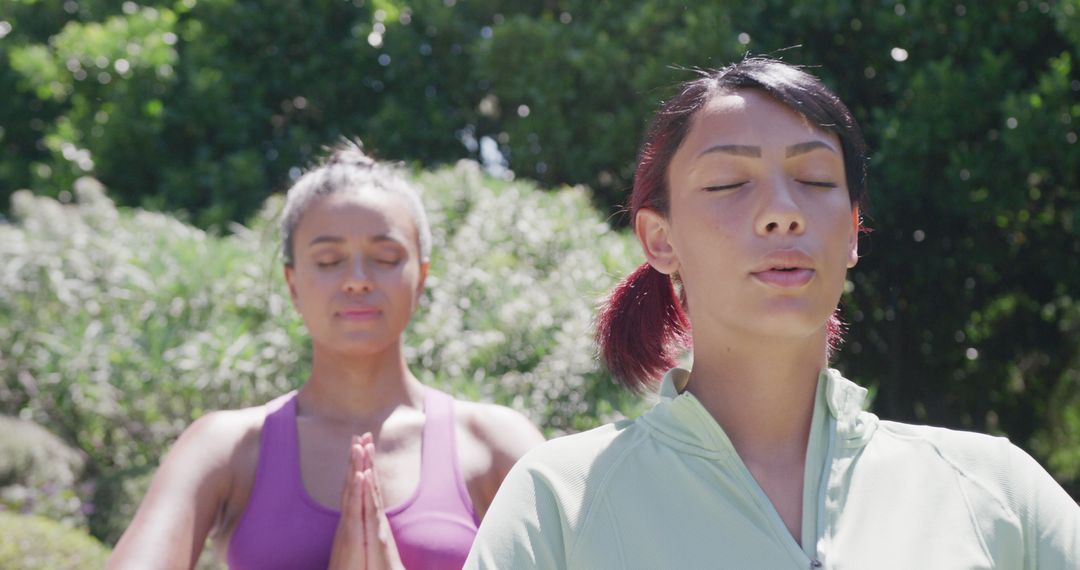 Women Meditating Outdoors in Sunny Garden - Free Images, Stock Photos and Pictures on Pikwizard.com