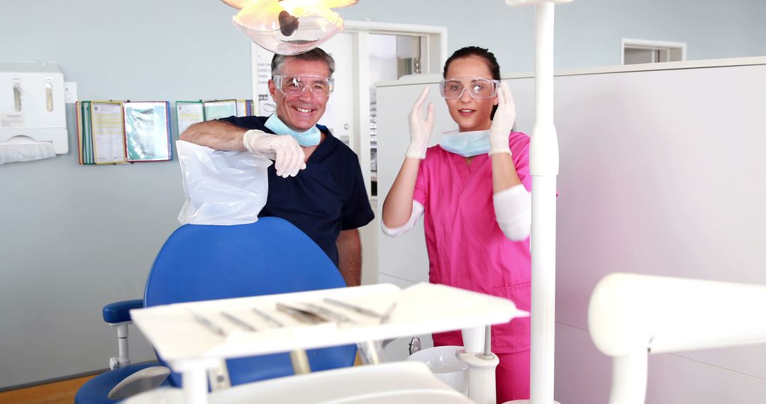 Dentist and Dental Assistant Smiling in Modern Dental Clinic - Free Images, Stock Photos and Pictures on Pikwizard.com