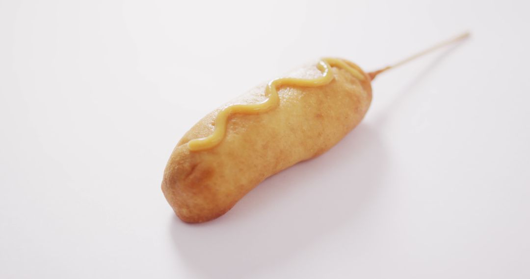 Corn Dog with Mustard on White Background - Free Images, Stock Photos and Pictures on Pikwizard.com