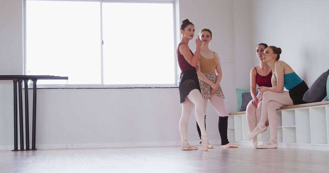 Ballet Dancers Relaxing in Studio During Rehearsal Break - Free Images, Stock Photos and Pictures on Pikwizard.com