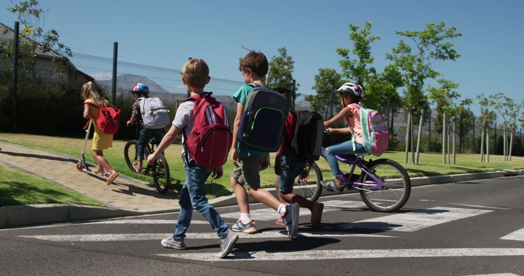 Group of Children Crossing Street with Bicycles and Backpacks - Free Images, Stock Photos and Pictures on Pikwizard.com