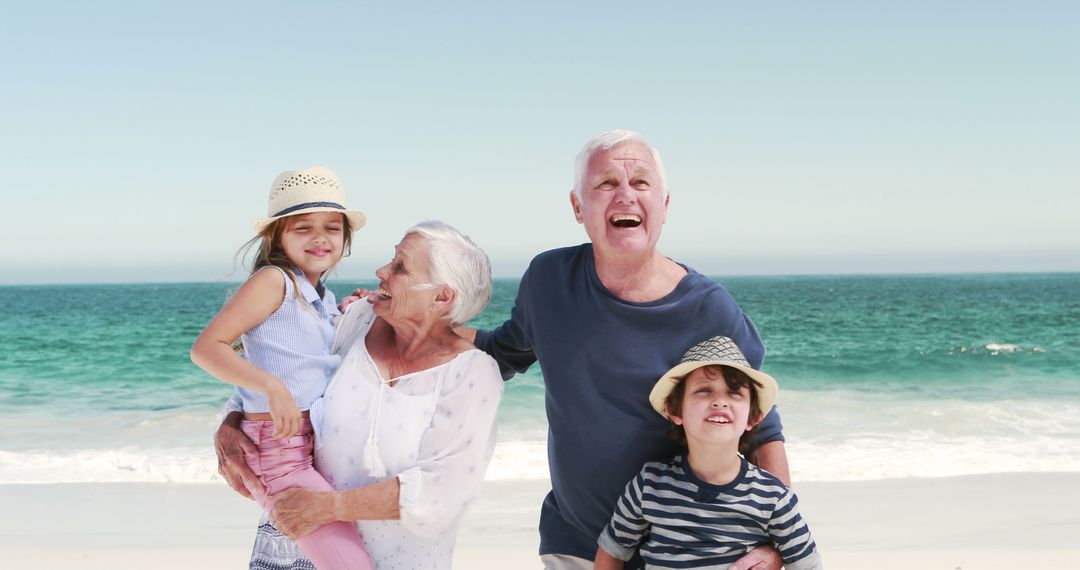 Happy Grandparents with Grandchildren on Sunny Beach Day - Free Images, Stock Photos and Pictures on Pikwizard.com