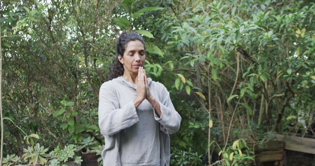 Woman Practicing Meditation in Tranquil Garden Setting - Free Images, Stock Photos and Pictures on Pikwizard.com