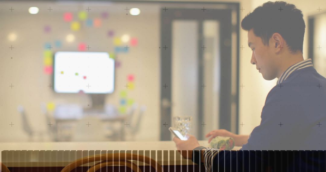 Asian Businessman Using Smartphone with Digital Interface Overlay