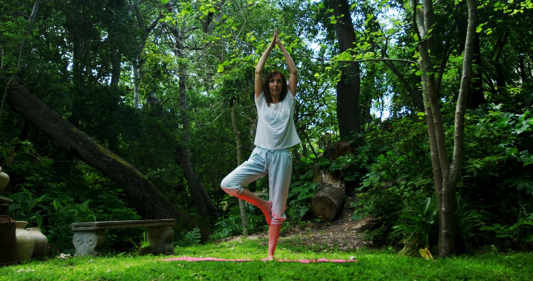 Woman Practicing Yoga in Serene Forest Setting - Free Images, Stock Photos and Pictures on Pikwizard.com