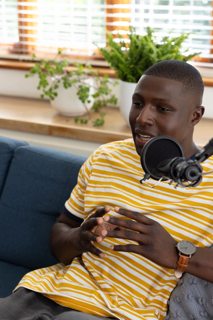 African American Man Podcasting in Casual Home Studio Setting