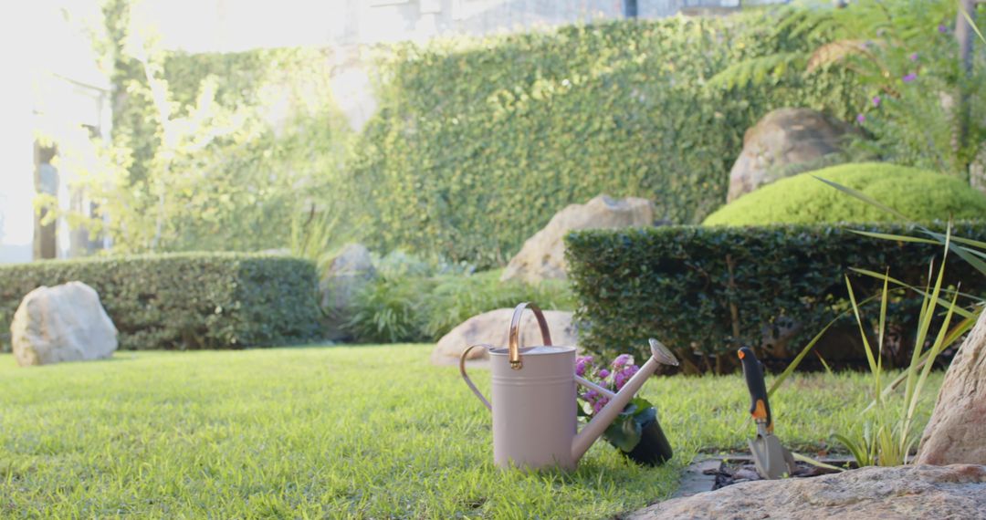 Tranquil Garden Scene with Watering Can and Lush Greenery