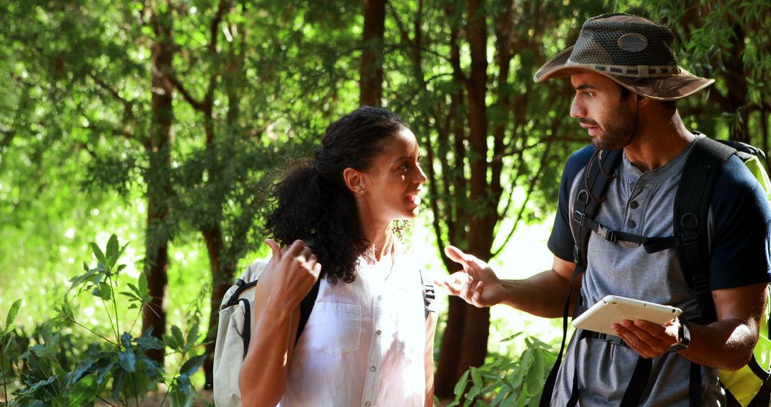 Young Researchers Discussing in Lush Forest Environment