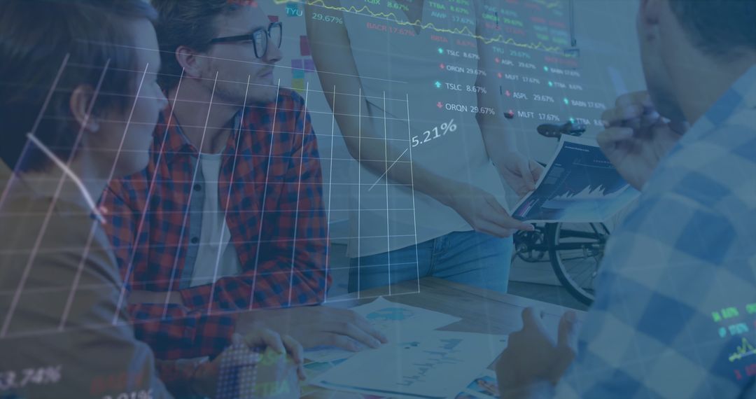 Diverse Team Analyzing Financial Chart Overlays Projection