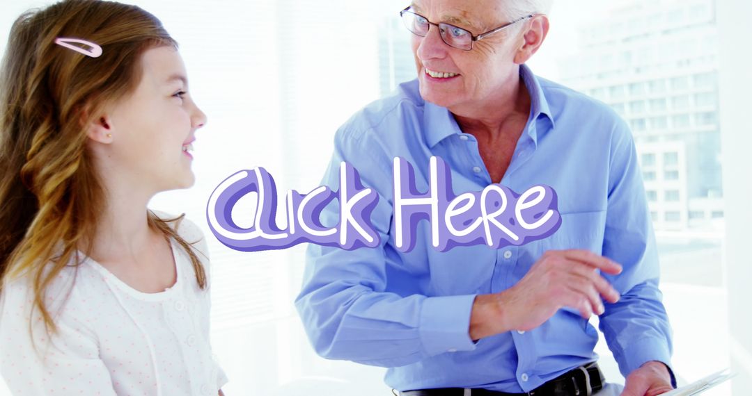 Grandfather with Granddaughter Bonding with Tablet in Bright Room