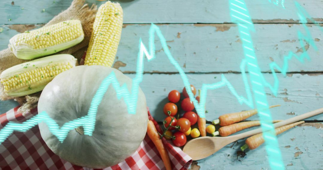 Pale green pumpkin resting on checkered cloth with corn, cherry tomatoes, carrots and ECG overlay