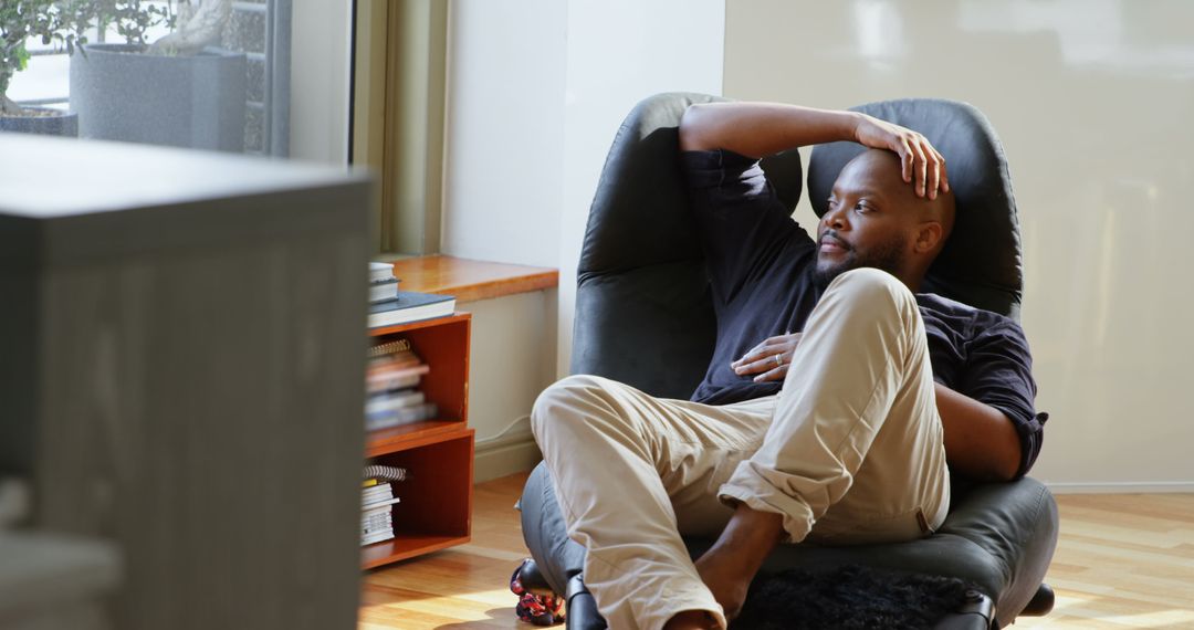 Relaxed Man Enjoying Downtime in Modern Home Interior
